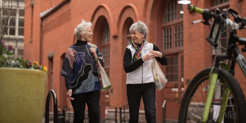 Two female seniors walking