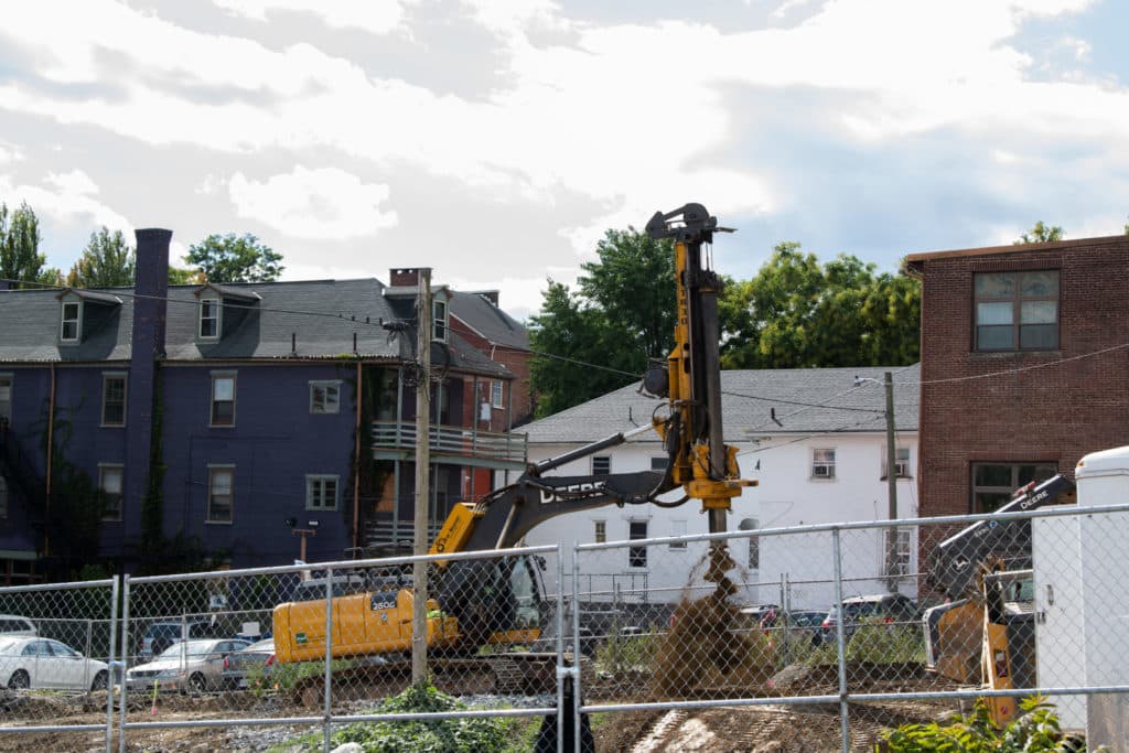 construction machinery digging a hole in dirt