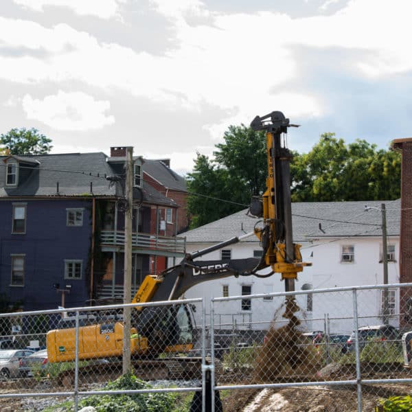 construction machinery digging a hole in dirt