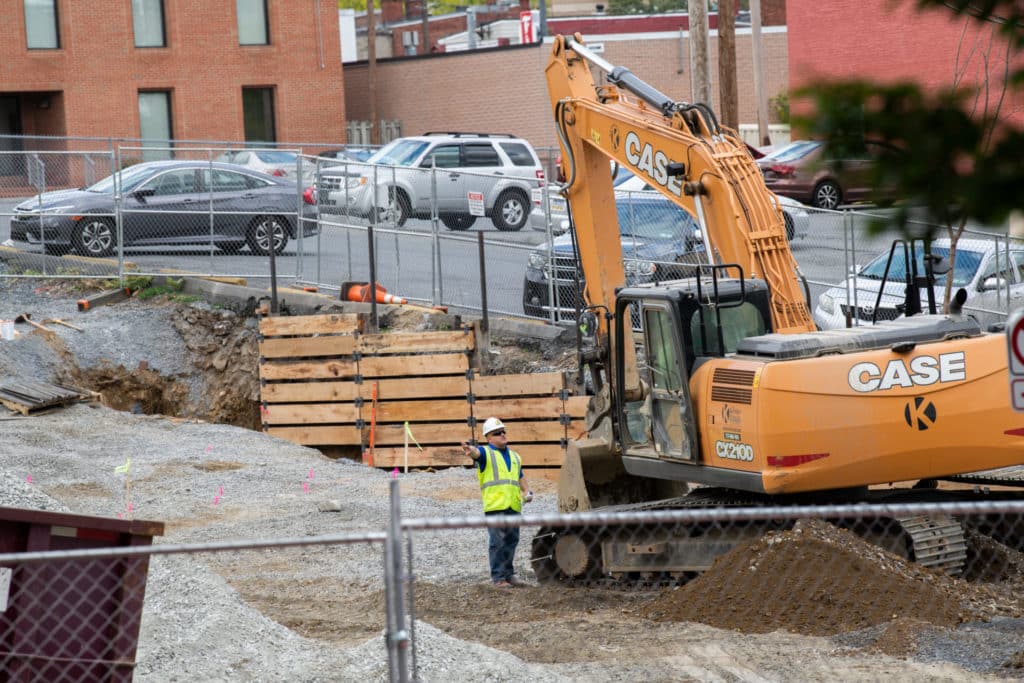 Construction worker and digger