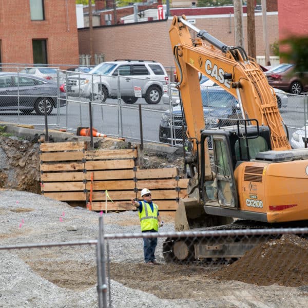 Construction worker and digger