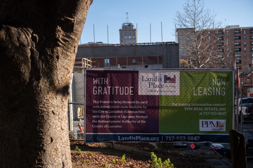 banner on fence at construction site