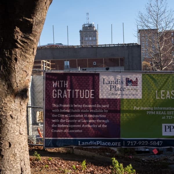 banner on fence at construction site