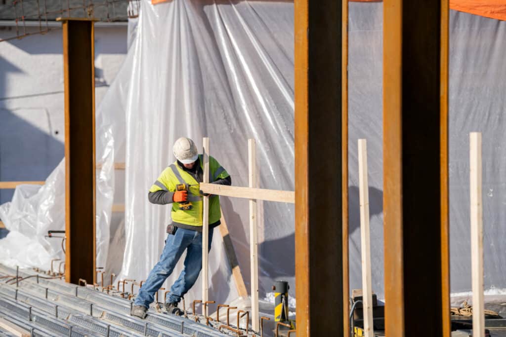 Construction worker building with wood