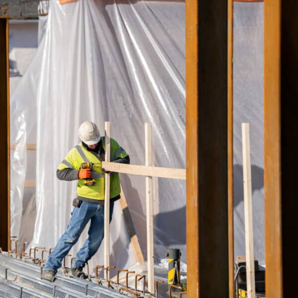 Construction worker building with wood