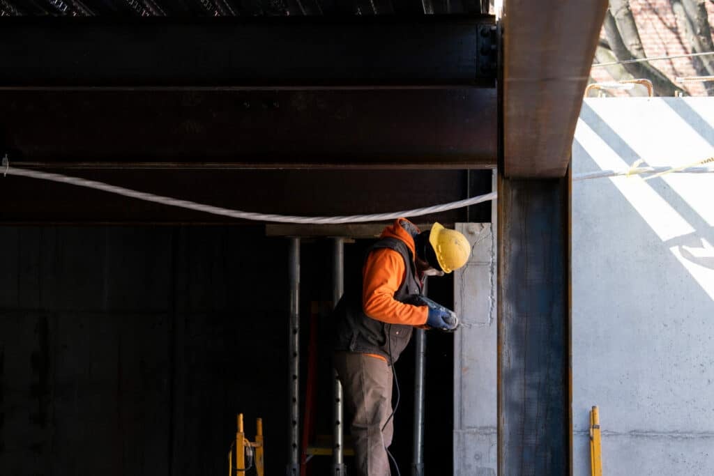 construction worker using a drill