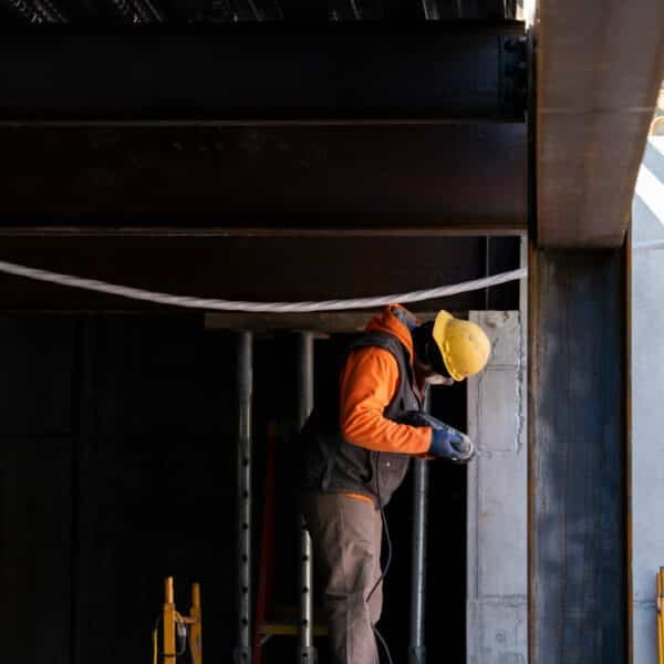 construction worker using a drill