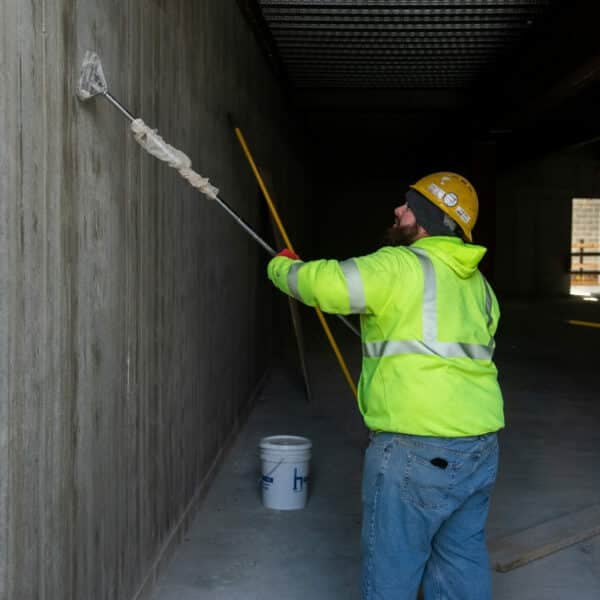 construction worker painting the wall