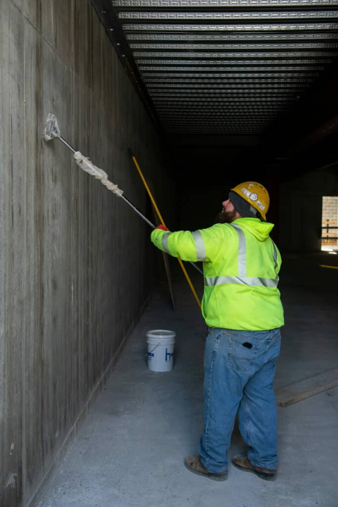 construction worker painting the wall