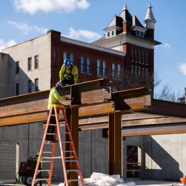 construction workers putting beams together