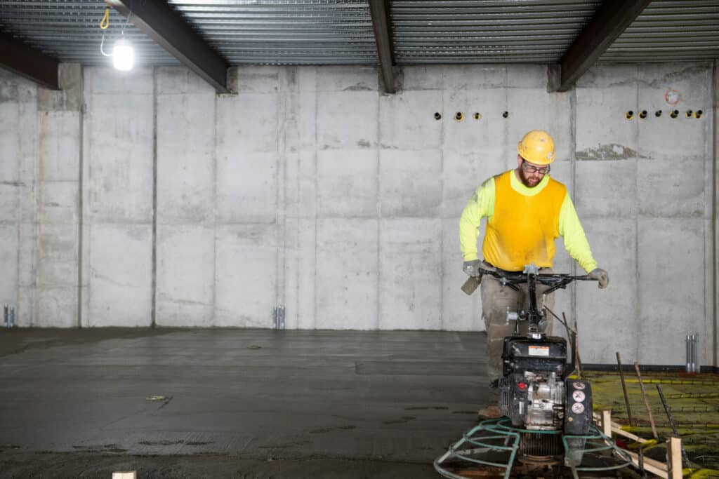 construction worker smoothing the floor