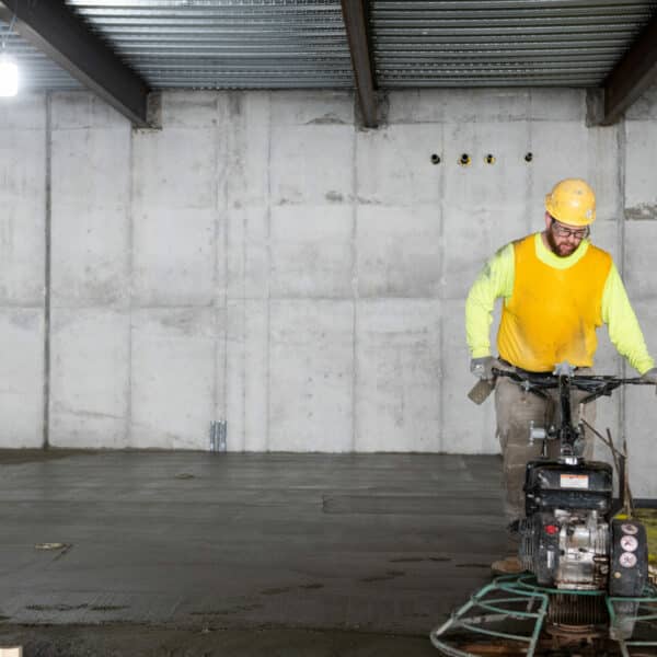 construction worker smoothing the floor