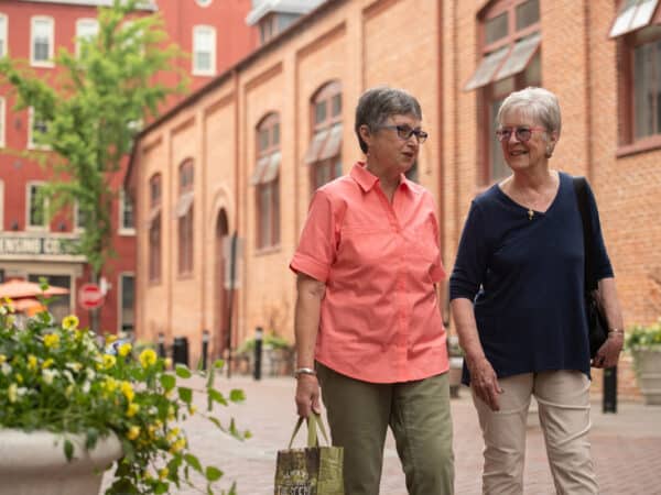 Two women walking outside