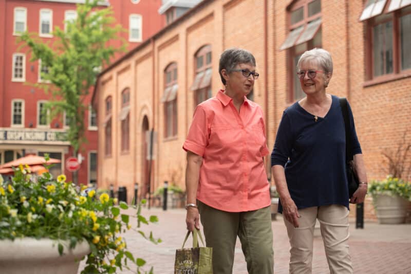 Two women walking outside