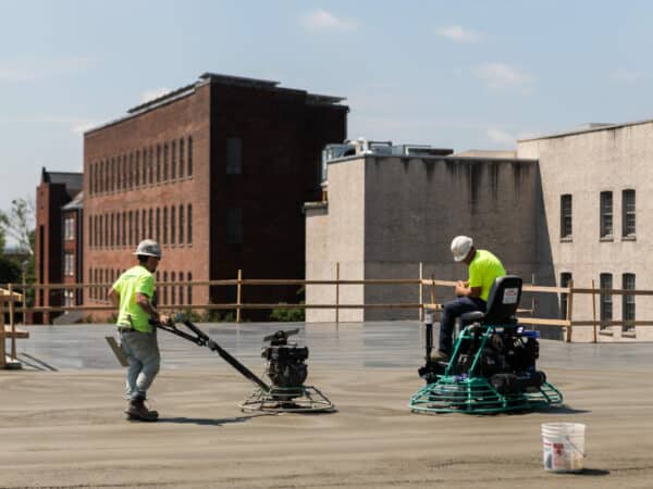 workers smoothing cement