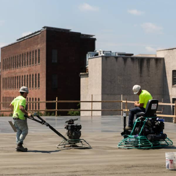 workers smoothing cement