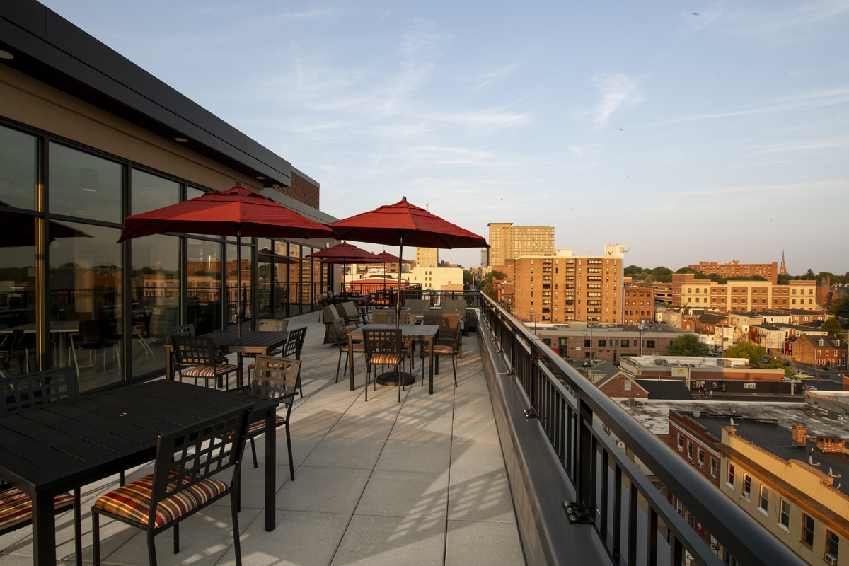two seniors talking at kitchen table